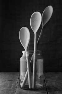 Black & White Photograph Of Three Wooden Spoons In A Jar