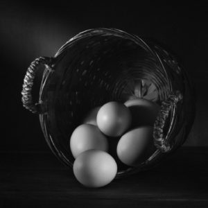 Black & White Photograph Of Eggs In A Basket